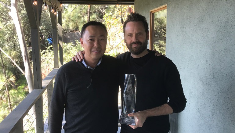 Pictured: BMI’s Ray Yee and composer Dustin O’Halloran with his BMI award.