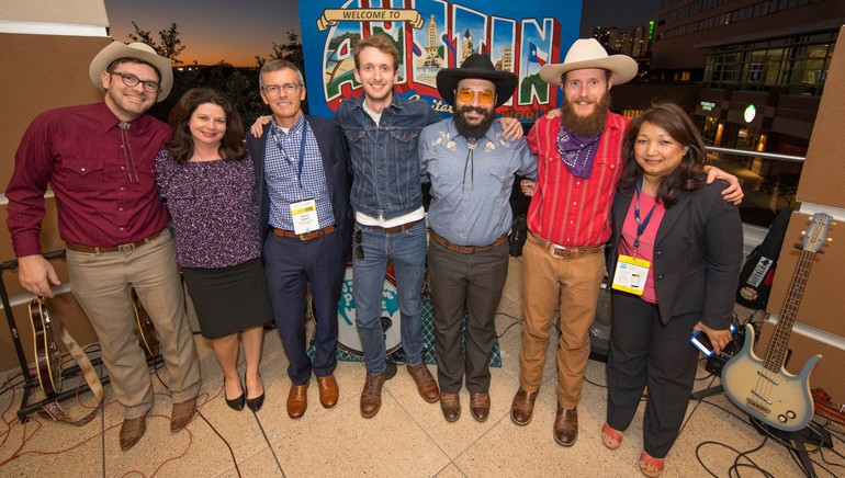 Pictured (L-R) after the band’s performance are: The Possum Posse’s Jomo Edwards (lead singer, acoustic guitar and fiddle), BMI’s Jessica Frost, NRA SVP Business Innovation Development Perry Quinn, The Possum Posse’s Jes Clifford (electric guitar), Ruthless Chris Steakhouse (drums), Brian Wolfe (upright bass) and NRA VP Sponsorship Kathie Vu.