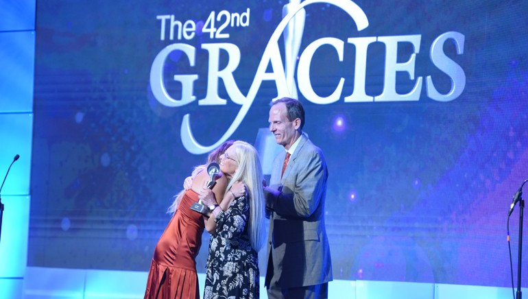 BMI’s Barbara Cane and Dan Spears present the very first Gracies Impact Award to Rachel Platten.