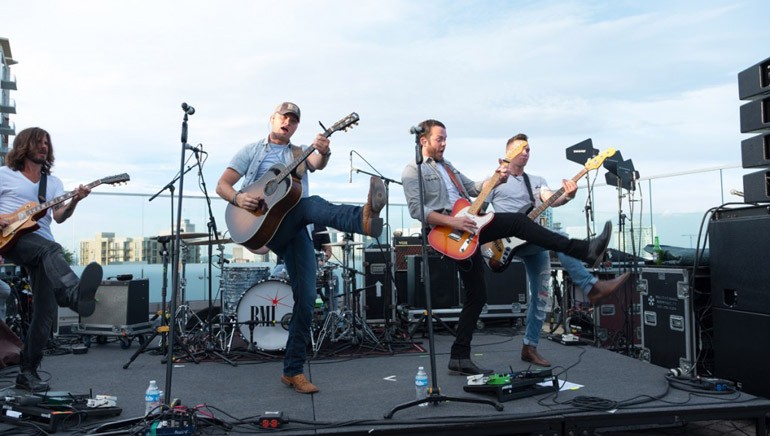 Duo Walker McGuire “kicked” off the fourth installment of BMI’s Rooftop on the Row Summer Series with an energetic performance on the rooftop stage.