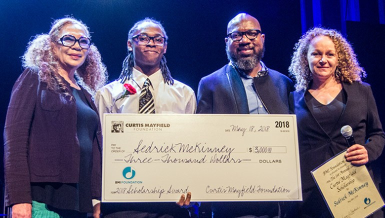 Pictured (L-R) are: Altheida (Mrs. Curtis) Mayfield, scholarship recipient Sedrick McKinney, Curtis’ son Cheaa Mayfield and BMI Foundation President Deirdre Chadwick.