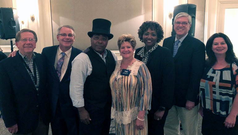 Pictured (L-R) after Chris’ electrifying performance are: MAB Board Chair and Retired iHeart Media executive Kenny Windham, LAB Board Chair and KATC-TV President/GM Andrew D. Shenkan, BMI songwriter Chris Thomas King, LAB President and CEO Polly Johnson, MAB President and CEO Karla Hooten, National Association of Broadcasters President and CEO Senator Gordon Smith and BMI’s Jessica Frost.