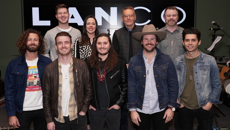 Pictured (L-R front row) at the No. 1 party are: lead guitarist Eric Steedly, lead singer and BMI songwriter Brandon Lancaster, drummer Tripp Howell, multi-instrumentalist Jared Hampton and bassist Chandler Baldwin. (back row): BMI’s Josh Tomlinson, Neon Cross’ Melissa Spillman, Sony Music Nashville’s Chairman and CEO Randy Goodman, Warner Chappell’s Ben Vaughn.
