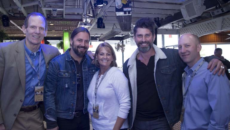 Pictured (L-R) after the performance at Fager’s Island are: BMI’s Dan Spears, BMI songwriter Hugh Mitchell, RAM Chairman Elect and Golden Corral Regional VP Kathie Sewell, BMI songwriter Dave Pahanish and RAM President/CEO Marshall Weston.