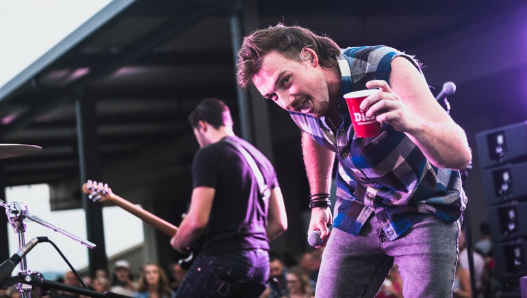 BMI songwriter Morgan Wallen enjoys a George Dickel beverage onstage.