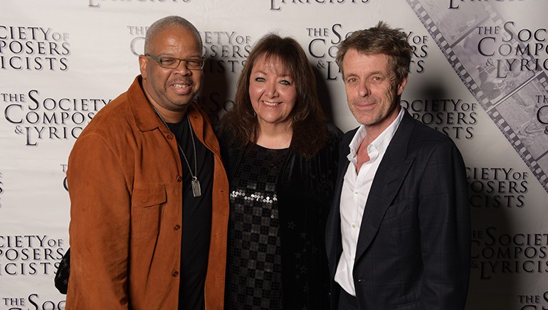 SCL Ambassador Award honoree Terence Blanchard, BMI’s Vice President of Film, TV & Visual Media Doreen Ringer-Ross and SCL Ambassador Award recipient Harry Gregson-Williams gather to celebrate the holidays during the Society of Composers & Lyricists annual party in Los Angeles on December 19, 2018.