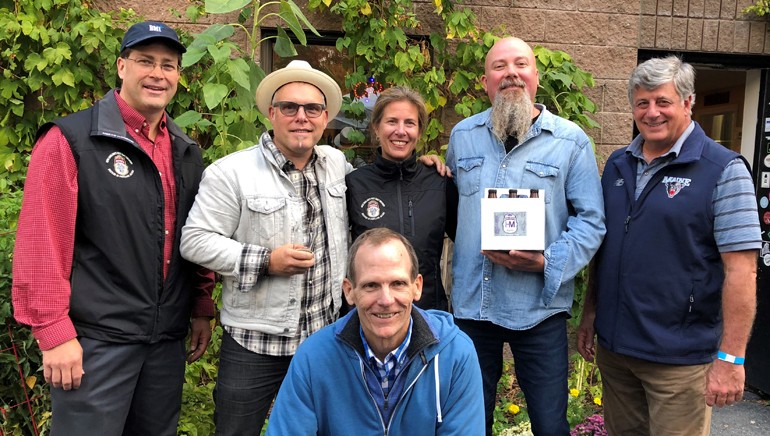 Pictured (L-R) before the performance at Geary’s Brewing are (standing): Geary’s Brewing co-owner Alan LaPoint, BMI songwriter Danny Myrick, Geary’s co-owner Robin LaPoint, BMI songwriter Kendell Marvel and HospitalityMaine CEO Steve Hewins. (Kneeling): BMI’s Dan Spears.