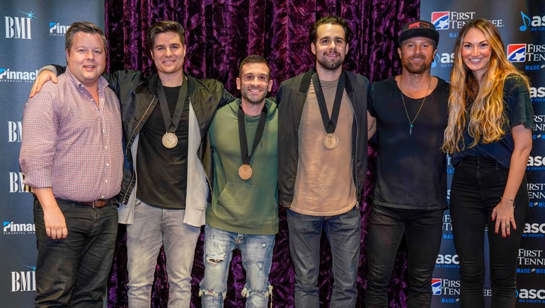 Pictured: BMI’s Bradley Collins, Steven Lee Olsen, David Garcia, Josh Miller, Kip Moore and ASCAP’s Evyn Mustoe gather for a photo at the celebration honoring “More Girls Like You.”
