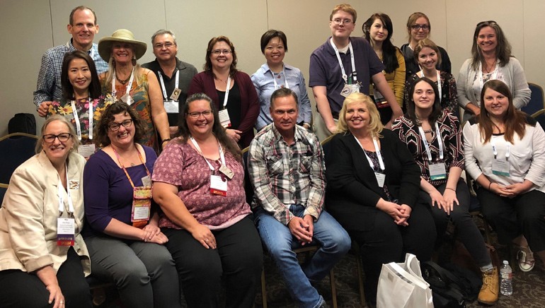 Tim James (seated in the center) and BMI’s Dan Spears (far left, standing) gather for a photo with some of the museum executives who attended BMI’s presentation on music licensing at the 2018 Mountain Plains Museum Association conference.