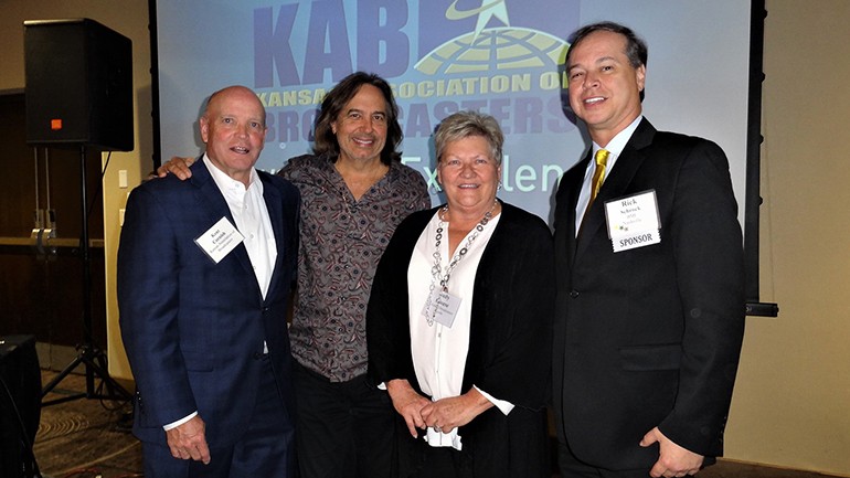 Gathered for a photo are: Kansas Associations of Broadcasters’ President, Kent Cornish, BMI songwriter James Slater, Kansas Association of Broadcasters’ Judy Clouse and BMI’s Rick Schrock.