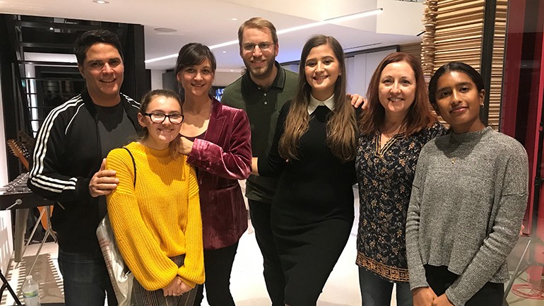 Pictured (L-R) are: mentor Tony Morales, student Sera Hornstein, mentor Rebecca Kneubuhl, University High School music director Micah Byers, student Francesca Borchardt, mentor Cindy O’Connor and student Charu Balamurugan during a recording session for the Uni Music Mentorship program in Venice, CA, on November 25.