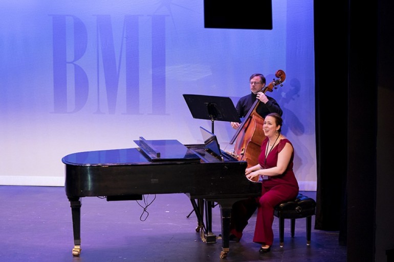 Composer and lyricist Erin Murray Quinlan performs the quirky medley “What I Mean” from “God Save Queen Pam” at the 2019 BMI Lehman Engel Workshop Showcase. Pictured on bass is Mark Wade.