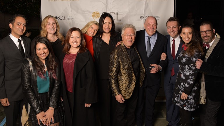 Pictured (L-R) at the Society of Composers & Lyricists’ holiday party are: Vivek Maddala, BMI’s Reema Iqbal, Ronit Kirchman, Cindy O’Connor, BMI’s Natalie Baartz and Alex Flores, SCL Lifetime Achievement Award honoree Alan Menken, Charles Fox, Fabrizio Mancinelli, Sherri Chung and Chris Lennertz. 