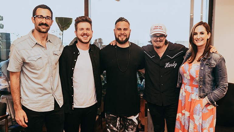 BMI's Branden Bosler and Josh Tomlinson, Filmore, HARDY and BMI's MaryAnn Keen gather for a photo before Rooftop on The Row.