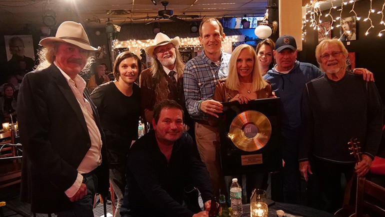 Pictured (L-R) after BMI’s presentation of a Gold Record to Florida Restaurant & Lodging Association President Carol Dover are: (kneeling): BMI songwriter Dylan Altman. (standing): BMI songwriter Earl Bud Lee, BMI songwriter and Warner Brothers recording artist Charlie Worsham, BMI Hall of Fame songwriter Aaron Barker, BMI’s Dan Spears, FLRA President Carol Dover, and BMI songwriters Bridgette Tatum, Tim James and Bruce Channel.