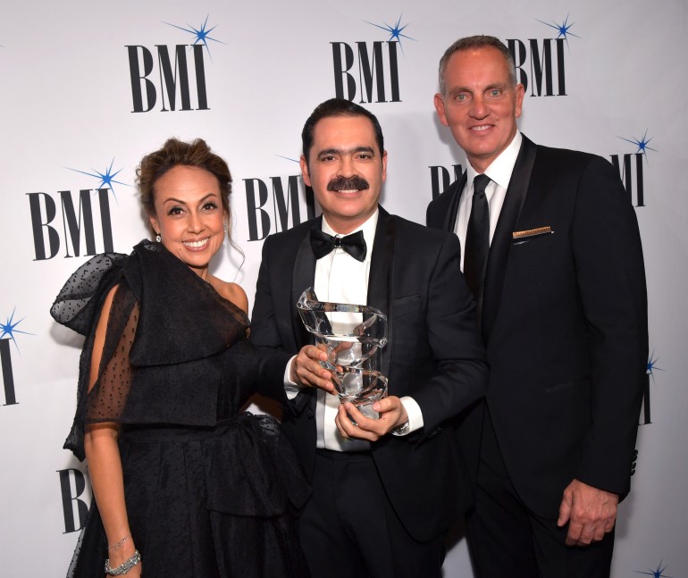 L to R: BMI's VP, Creative Latin Music Delia Orjuela, BMI Presidents' Award recipient Mario Quintero Lara, and BMI President & CEO Mike O'Neill together at the 26th annual BMI Latin Awards
