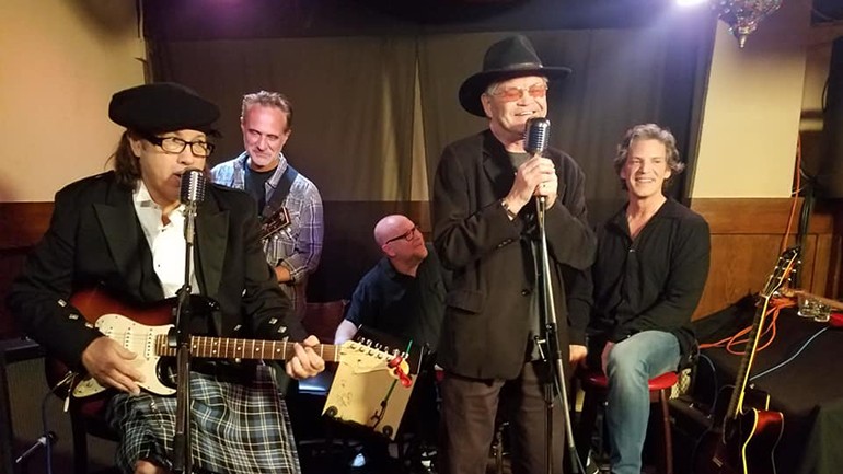Pictured on stage are New Monkees Marty Ross, Jared Chandler and Dino Kovas, original Monkee Micky Dolenz, and New Monkee Larry Saltis.
