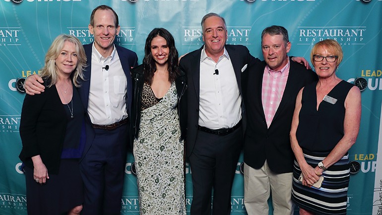 Pictured (L-R) before Rozzi’s performance at the 2019 Restaurant Leadership Conference in Phoenix are: Colorado Restaurant Association Vice President of Strategic Partnerships Devany McNeill, BMI’s Dan Spears, BMI singer-songwriter Rozzi, Winsight Group President of Restaurant & Media Events Chris Keating, Barley Creek Hospitality Group President Trip Ruvane and Winsight Senior Vice President and Restaurant Leadership Conference Director Carol Walden.