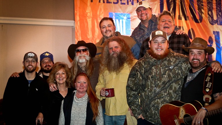 L to R: Ray Fulcher, Ben Burgess, Mountain High Music Festival’s Susie Dillon and Sheryl Steinmeyer, BMI ICON Dean Dillon, Jamey Johnson, Luke Combs, Randy Houser; Top Row: BMI’s Mason Hunter, The Highway’s Storme Warren, and BMI’s David Preston