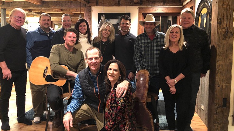 Pictured (L-R) after the unplugged BMI songwriter performance in Crested Butte are: (standing) Todd Guthrie, BMI’s Mason Hunter, Eastman Radio President Tucker Flood,  Katz Radio Group President Christine Travaglini, Colorado Restaurant Association Vice President of Strategic Partnerships Devany McNeill, Colorado Broadcasters Association President Justin Sasso, BMI songwriter Scotty Emerick,  Cox Media President Kim Guthrie and BMI’s David Preston. (sitting/nneeling): BMI songwriter Josh Martin,  BMI’s Dan Spears and Colorado Restaurant Association President Sonia Riggs.