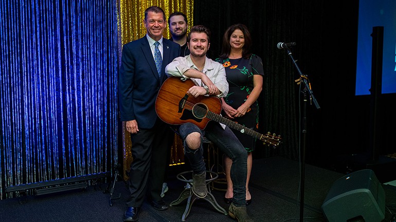 Pictured (L-R) before Dylan Schneider took the stage are Arland Communications President and Indiana Broadcasters Association Executive Director Dave Arland, BMI singer-songwriter Dylan Schneider, 1021 Entertainment Artist Manager Joey Russ, and BMI’s Jessica Frost.