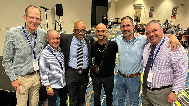 Pictured after Sie7e’s performance at the ASORE Bakery and Restaurant Show in San Juan ( L to R): BMI’s Dan Spears, El Meson de Melquiades owner Oscar Tirado, ASORE Executive Director Gadiel LeBron, BMI songwriter Sie7e, Sobao by Los Cidrines owner and ASORE Board President Mateo Cidre, International Restaurant Services Senior Vice President of Operations Ramon Leal.