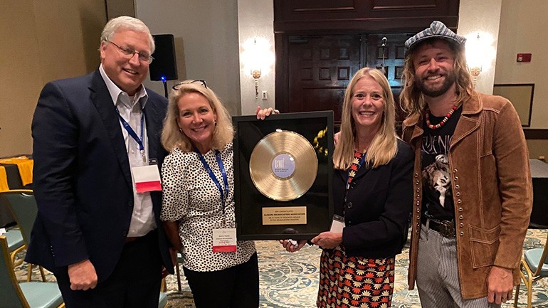 After Paul McDonald’s performance, BMI presented ABA President Sharon Tinsley with a gold record. Pictured (L-R) are ABA Board Chairman and Gray Television VP & General Manager WSFA Mark Bunting, ABA President Sharon Tinsley, BMI Associate Director Amy Glover and BMI recording artist Paul McDonald.