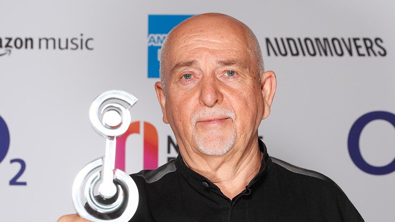 Peter Gabriel poses with the night’s flagship honour, the O2 Silver Clef Award, at the JW Marriott, Grosvenor House, London on July 1.