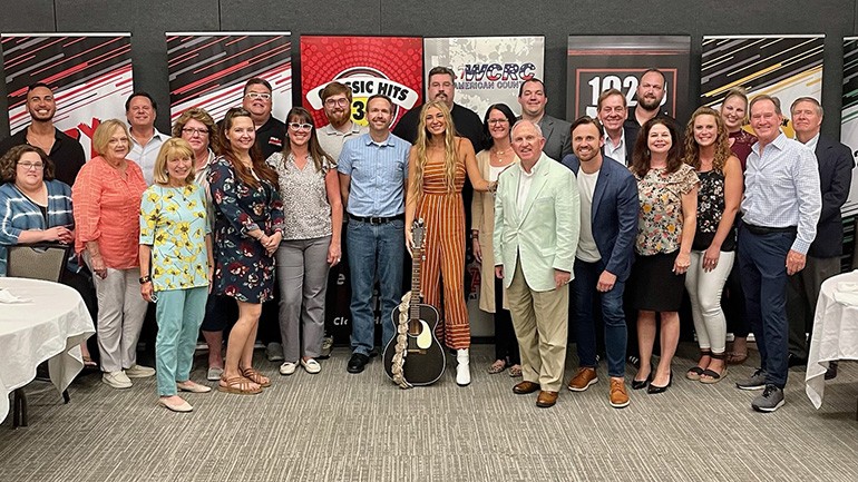 Pictured are BMI recording artist Julia Cole and guitar player Alejandro Medina III with The Cromwell Group’s President & CEO Bud Walters, BMI’s Jessica Frost and the general managers team.