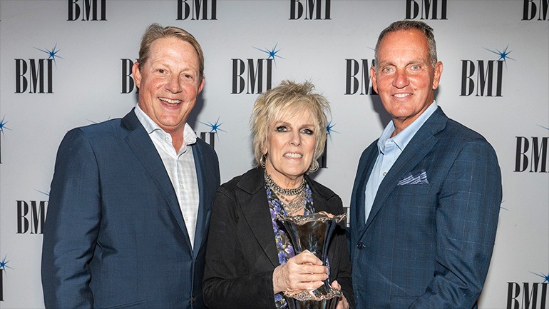 Lucinda Williams (center) with VP, Creative, Nashville Clay Bradley and BMI President & CEO Mike O’Neill
