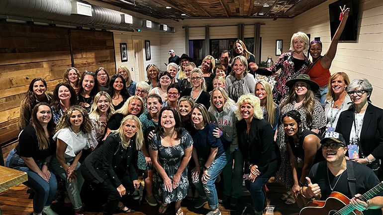 After her performance at the Rising Through the Ranks dinner, Big Loud Records recording artist Lauren Alaina gathered for a photo with the RTTR Class of 2022 along with BMI executives and several RTTR speakers.