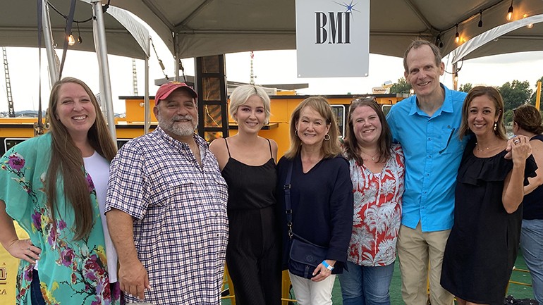 Pictured (L-R) before BMI songwriter Maggie Rose hits the Floating Stage at The Wharf in DC are National Association of Broadcasters Vice President of Government Relations Nicole Gustafson, Pearl Street Warehouse owner Nick Fontana,  BMI songwriter Maggie Rose, National Association of Broadcasters Senior Vice President of State, International & Board Relations Sue Keenom, Restaurant Association of Metropolitan Washington Managing Director Julie Sproesser, BMI’s Dan Spears, and Restaurant Association of Metropolitan Washington CEO Kathy Hollinger.