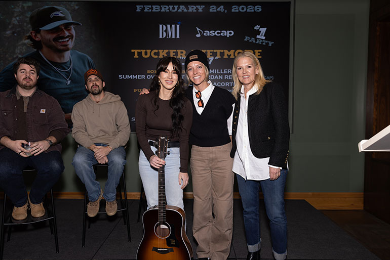 Overstreet is gifted with a custom Taylor 210e DLX guitar