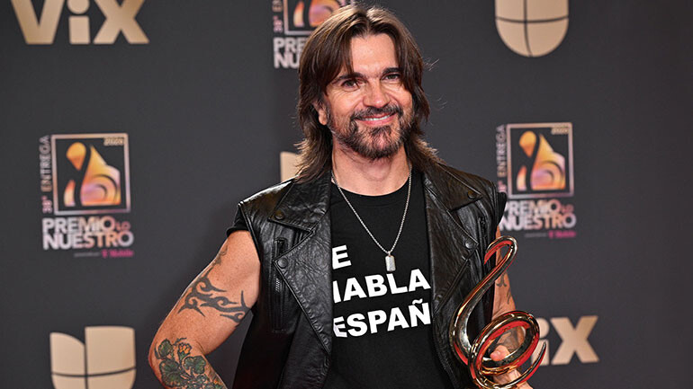 Juanes accepts the Lifetime Achievement Awards at the 38th annual Premio Loe Nuestro in Miami.