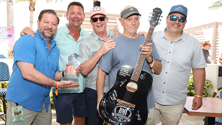 (Photo L-R): 2022 BMI Ambassador Xperi’s Joe D’Angelo, 2020 BMI Ambassador Storme Warren, BMI’s Clay Bradley, 2026 BMI Ambassador and Key West Songwriters Festival founder Charlie Bauer, and BMI’s Mason Hunter pose at the festival’s anniversary reception.