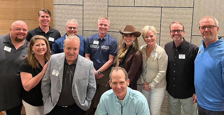 Pictured before BMI songwriter Catie Offerman performs at the Hubbard Broadcasting Management Meeting (L to R): Back row: Hubbard Radio Vice President & Market Manager- Cincinnati Mike Fredrick, Hubbard Radio Vice President & Market Manager- Minneapolis/St. Paul Dan Seeman, Hubbard Radio Executive Vice President & CFO Dave Bestler, BMI songwriter Catie Offerman, Hubbard Radio Vice President & Market Manager- West Palm Beach Elizabeth Hamma, Hubbard Radio Vice President & Market Manager- Chicago Keith Lawless, Hubbard Radio Vice President & Market Manager- Brainerd Jeff Hilborn. Front row: Hubbard Radio Regional General Manager for Central Minnesota Matt Senne, Hubbard Radio Director of Digital Media Amy (Foxx) Senne, Hubbard Radio Senior Vice President of Programming Greg Strassell, BMI’s Dan Spears.