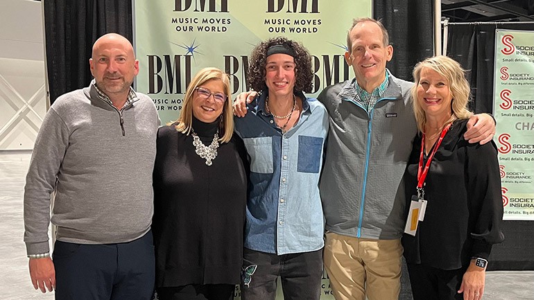 Pictured before BMI songwriter Sawyer Utah takes the stage at the Restaurant Insights Summit in Green Bay (L to R): Outback Steakhouse Managing Partner and Wisconsin Restaurant Association Board Chair-elect Brad Hammen, Wisconsin Restaurant Association CEO Kris Hillmer, BMI songwriter Sawyer Utah, BMI’s Dan Spears, Wisconsin Restaurant Association Vice President of Membership & Business Development Dawn Renz Faris.