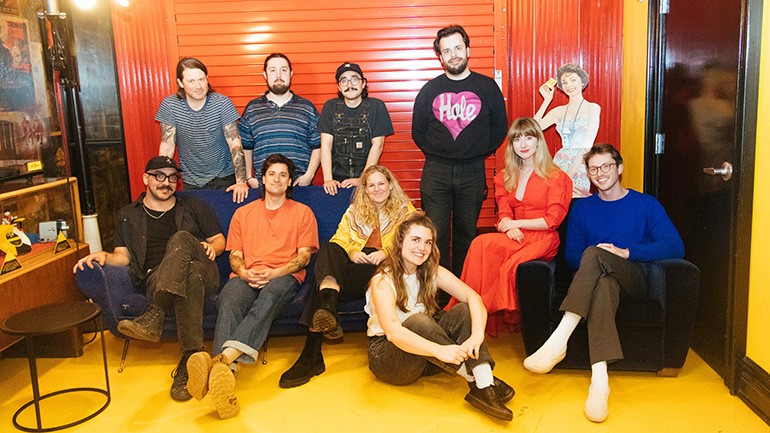 Members of Carol, The Blonde Bones, Olivia Barton, and BMI’s Nina Carter and Tyler Burns backstage at the Blue Room.