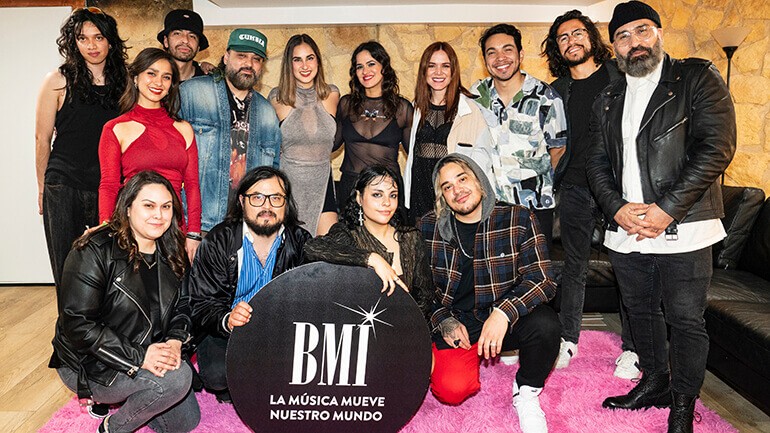 (Top, L-R) Girl Ultra band member, Adria Del Valle of Estereomance, Girl Ultra band member, El Dusty, Paulina Reza of Estereomance, Neysa Blay, Caravanchela and BMI’s Jesus Gonzalez, (Bottom, L-R) BMI’s Lilibeth Patron, Manuel Calderon of Estereomance, Girl Ultra and Jona Camacho pose for a photo backstage at BMI’s Sonidos showcase at Parish in Austin, TX on March 15, 2023.