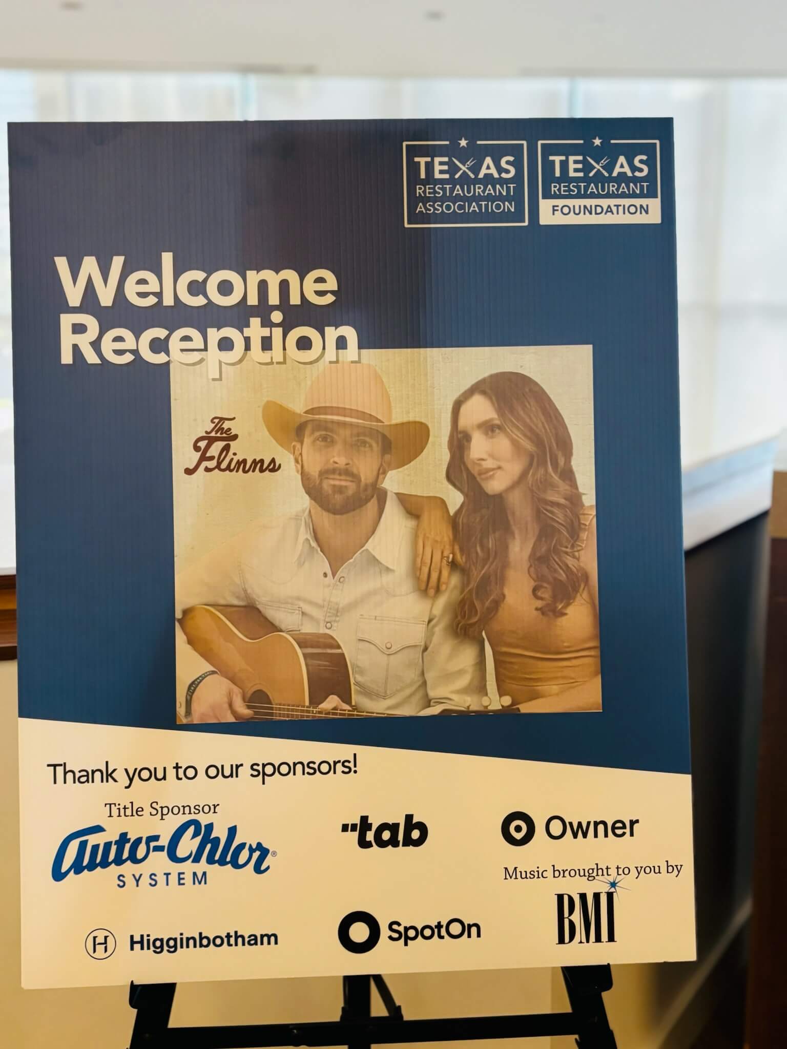 Welcome Reception poster highlighting The Flinns.